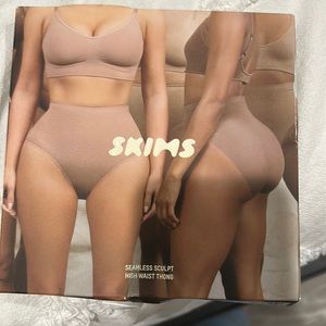 Skims high waist thong. Never worn. In original box.